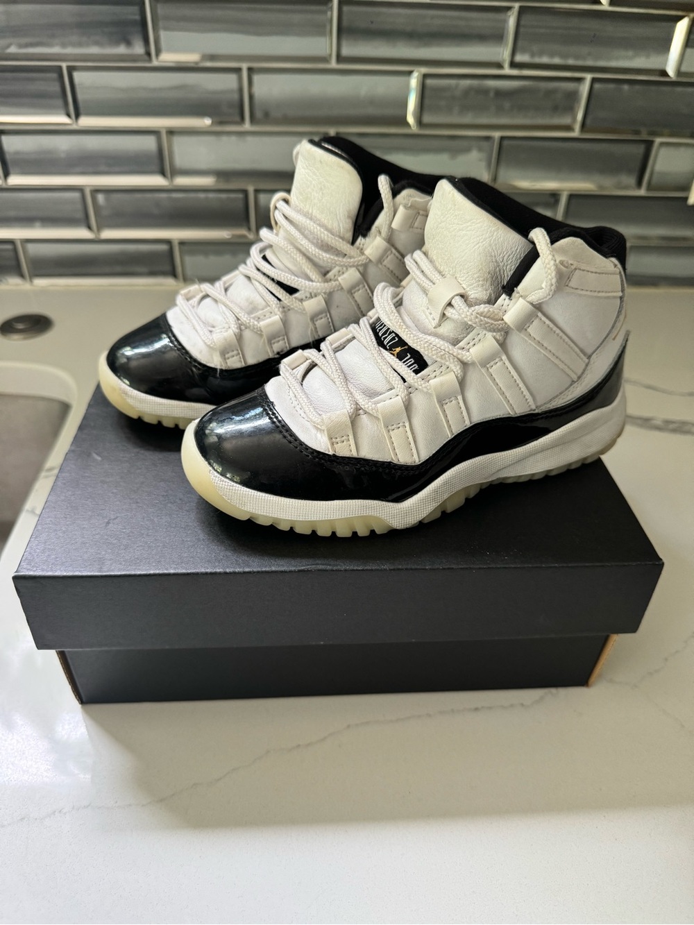 Jordan Kids Black and White High Top Sneakers